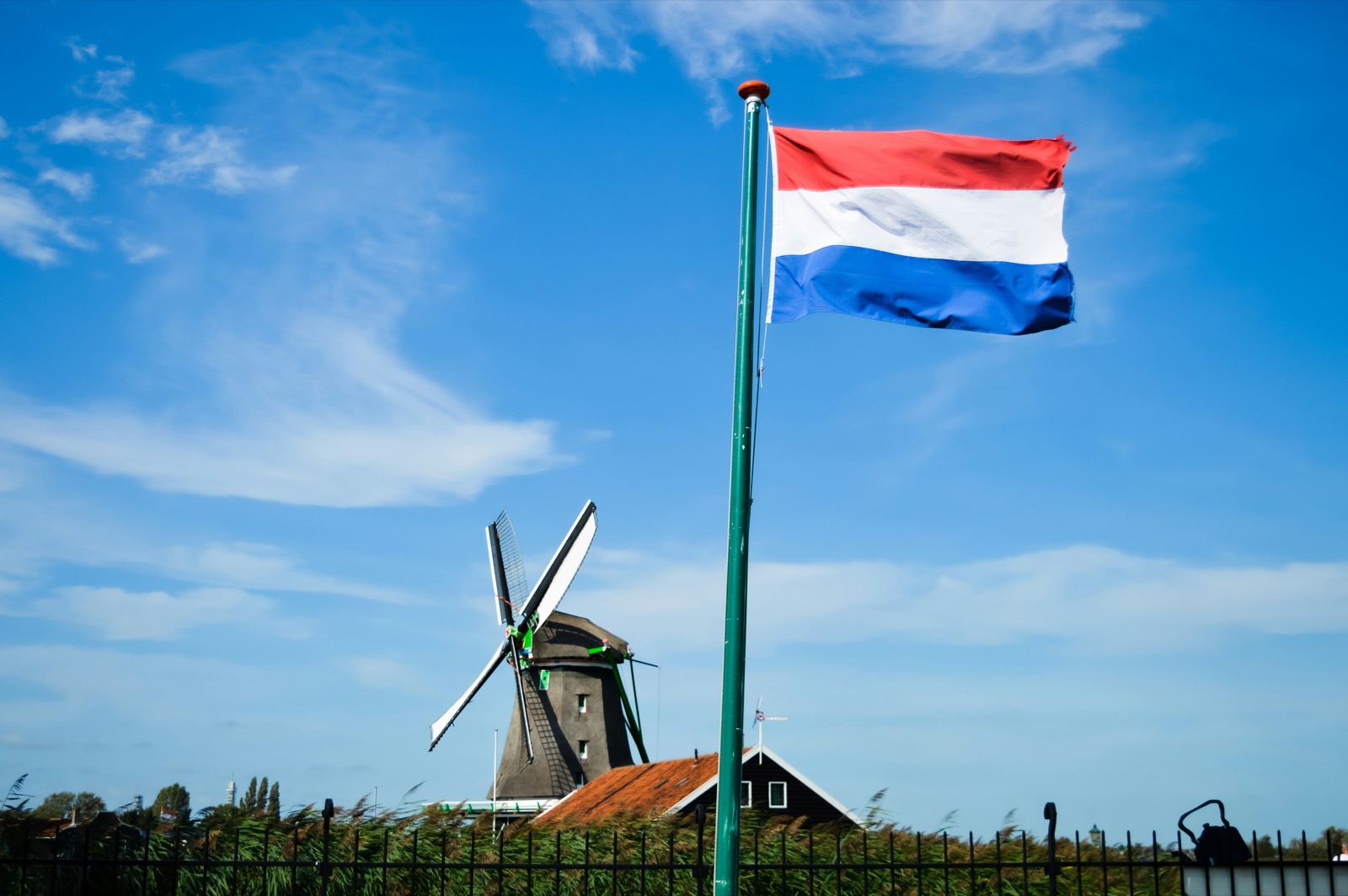 Dutch windmill with the Dutch flag